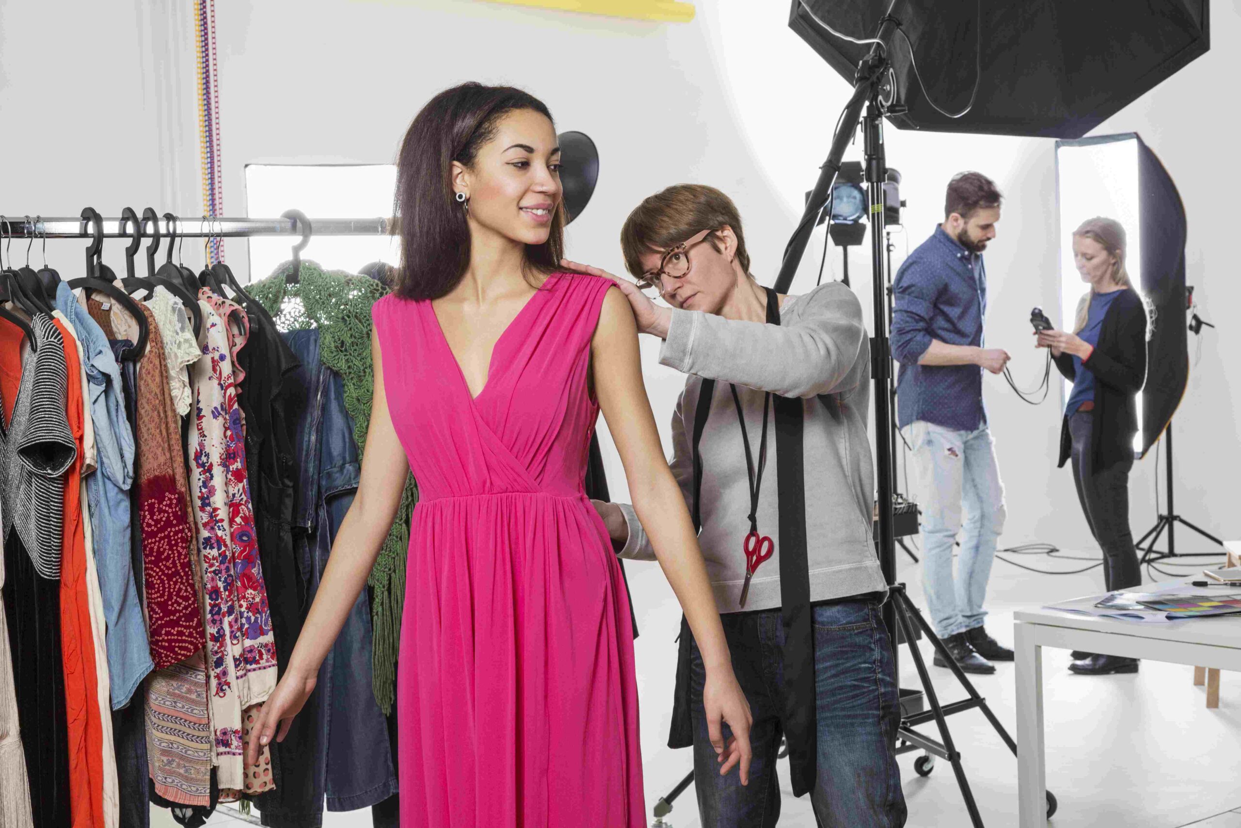 stylist-fastening-fashion-model-s-dress-scaled